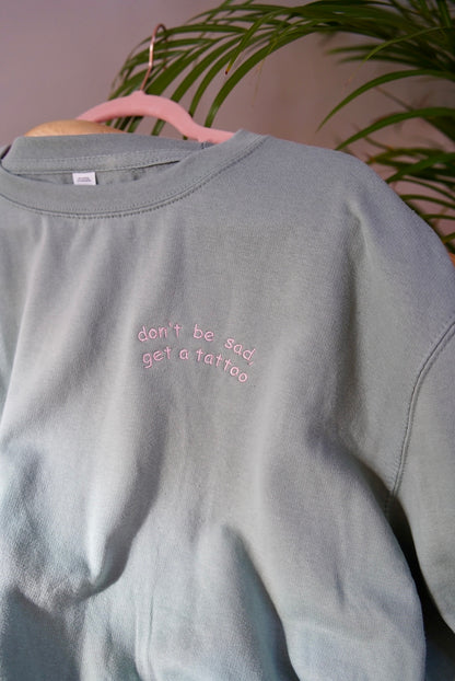 Don't be sad, get a tattoo (sweater of hoodie)